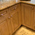 Nu duo periwinkle and deep gold knobs sparkle on kitchen cabinetry.