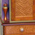 Custom bloomer knob and matching corner finial are special design details.