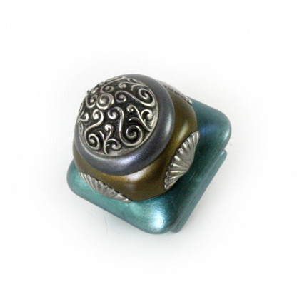 Mini Tudor knob 1.5 in. colored in aqua, bronze and pewter with silver metal accents.