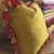 Lido pillow has fancy red and  gold tassel trim.
