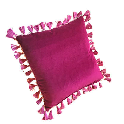 Rio pillow with tassel trim has duo color scheme. One side is lush velvet in hot fuchsia pink. The reverse is silk nugget green.