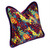 Cabo Pillow covered in splashy colorful printed silk and trimmed with velvet piping