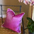 Chelsea pillow fuchsia and dot is at home with a moth orchid plant.