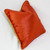 Flip side of Milan pillow is covered in velvet in coppery orange
