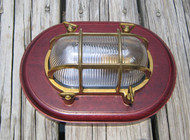 oval nautical light with wooden trim ring