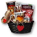 A great assortment of coffee, latte mix, mug, cookies and chocolate.