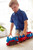 Eco-friendly Green Toys Train set in play, fostering creative play and motor skills development.