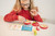 Child playing with Apple Puzzler – educational brain teaser toy