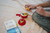 Child playing with Apple Puzzler – educational brain teaser toy and book