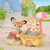 Deer Mother articulated figure in donut motif uniform with market trolley