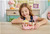 Girl playing with Sylvanian Families Dip Dip Donuts Wagon SF5808 