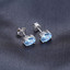 1 9/10 CTW Oval Blue Topaz 4-Prong Stud Earrings in 0.925 White Sterling Silver (MDS170117)
