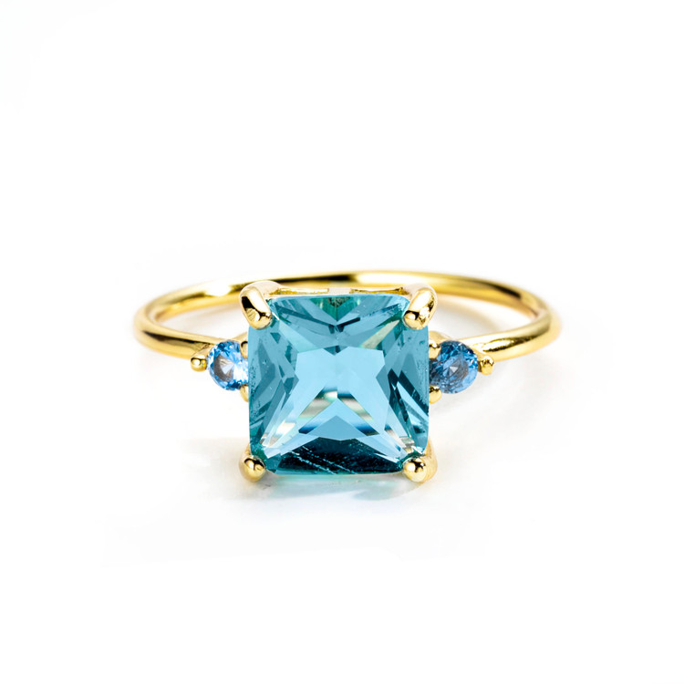4 2/5 CTW Princess Blue Cubic Zirconia Three-stone Cocktail Yellow Gold Plated Ring in 0.925 Sterling Silver (MDS230216)