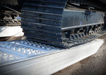 Steel Tracks Excavator loading with Digga Universal loading ramps sold at Digrite