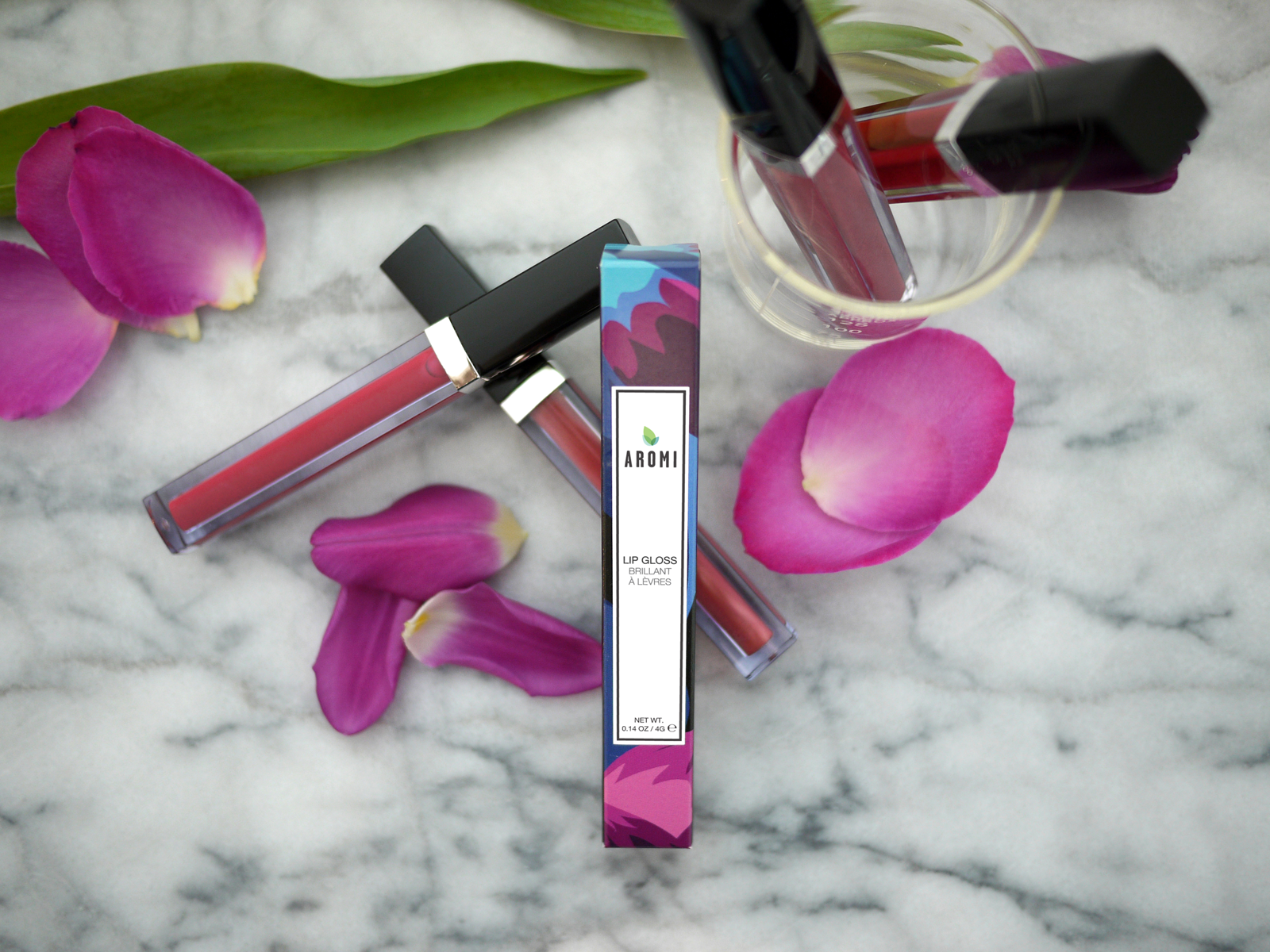 Aromi Lip Gloss - Handmade in small batches with the finest ingredients. Aromi lip gloss has a non-stick formula that gives a high-shine lip and comes in a wide variety of colors.
