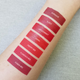 red liquid lipstick swatches on lighter skin