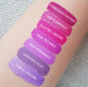 Aromi pink and lilac liquid lipstick shades on light skin