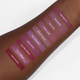 Aromi pink and mauve liquid lipstick shades on darker skin