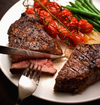 organic-grass-fed-beef-steak-cut-knife-fork.jpg