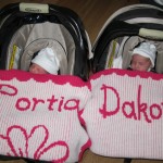 Twin Baby Girls LOVING their stroller blankees!