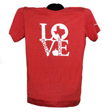 Heather canvas red shirt with LOVE in white print, Texas Public Schools in red, inside of the O V and E, with image of white apple 