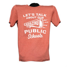 Red shirt with white text let's talk about our amazing public schools. Amazing is printed inside the outline of a megaphone 