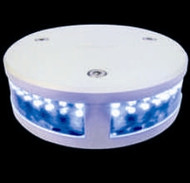 A black background with a white round circle. Bright light blue lights on the front.