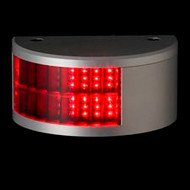 A black background with a silver half circle light base. Two rows of red lighting on the left side
