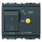 A dark grey square circuit breaker.  A push button switch on the left. A yellow circle in the center with a green circle on the top left.