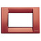 A rusty red colored square cover plate. a white square middle. on a white background