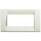 An ivory rectangle cover plate. with an empty white center. Ona . white background.