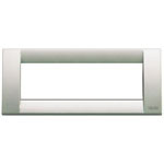 A white champagne color rectangle cover plate. Skinny and long. no center. on a white background