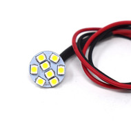 A small Emma 8SMD. Round with yellow square lights on the inside. Wires attached. On a white background