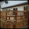 Miterless deck post caps can save your deck's life. This deck was constructed using 4x4 posts which were topped with our Miterless Post Caps™ for ultimate protection. Cedar decks with Mahogany wooden post caps make for a great looking combination that is made to last.