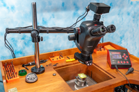 Leica Ivesta 3 Microscope with C-Mount mounted on a bench with a Swing Arm Stand, 4K Camera, .63 Objective Lens, LED Light and Polarizer.  The PulseGraver from Engraver.com is also on this bench.