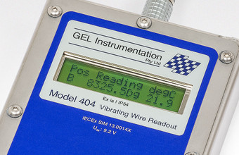 Close-up of the Model 404 Intrinsically Safe Vibrating Wire Readout LCD display.