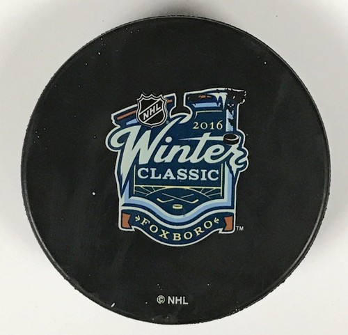 This is 1 of 20 pre game warm up pucks used by either the Boston Bruins or the Montreal Canadiens prior to the 2016 Winter Classic (front view).