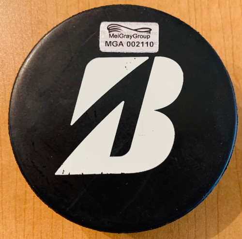 These pucks used in the 2016 Bridgestone NHL Winter Classic warm up all featured the unique NHL Winter Classic 2016 logo and the Bridgestone logo for this pre game warm up only. (Back view)