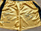 These yellow Everlast boxing trunks have been signed by 5 of the best know Heavyweights in boxing history:

GEORGE FOREMAN
KEN NORTON
LEON SPINKS
EARNIE SHAVERS
FRANK BRUNO