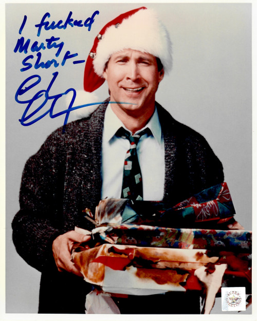 This is an 8x10 photo that has been autographed by Clark Griswold himself....CHEVY CHASE with inscription.