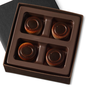 Smooth dark chocolate coffee ganache comes together with a layer of creamy mascarpone in a dark chocolate shell in a four piece gift box. 
