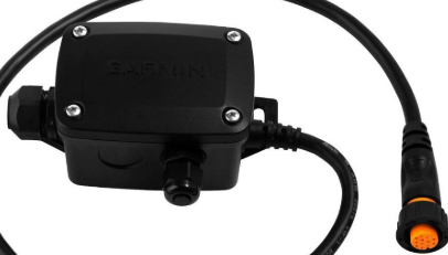 Under‑console view of adapter installed with transducer and device wiring.