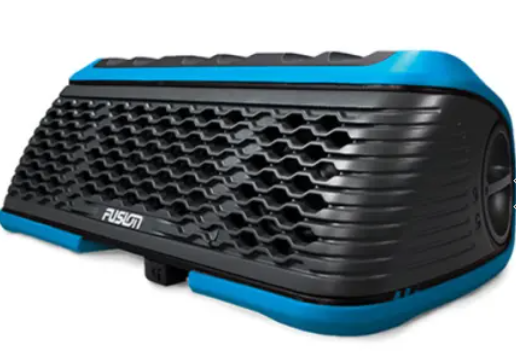 Stereo illuminated while in use on a boat dash.