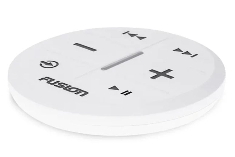 Remote next to compatible Fusion stereo showing zone control features.