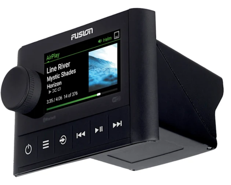 Installed unit on a boat dash with marine speakers connected.