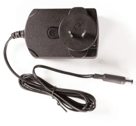 Rear view showing voltage and safety markings on the adaptor label.