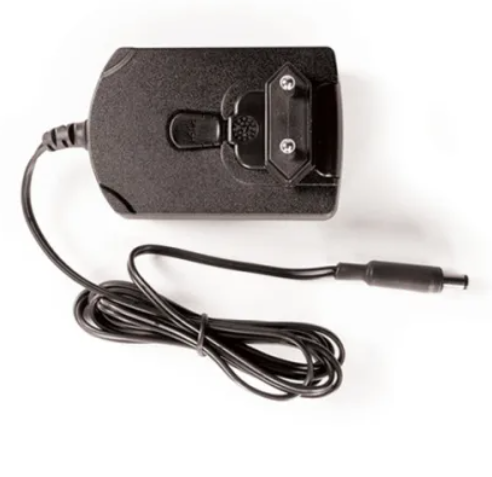 Power adaptor next to the StereoActive&trade; for scale comparison.