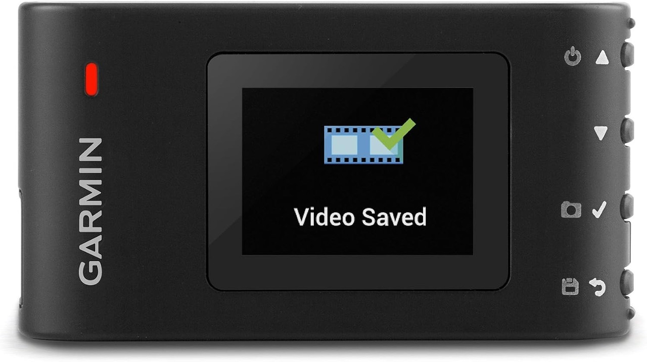 Garmin Dash Cam 30 connected to a vehicle power source for continuous road recording.