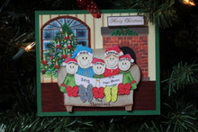 This is our new ornament for 2012.  Check out the Christmas tree in the background, it is adorned with past family ornaments!!