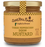 Front view of a jar of 3 Peppercorn Dijon mustard